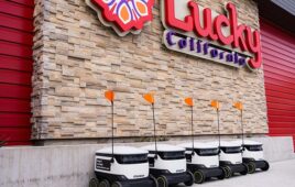 Starship delivery robot lined up in front of Lucky store