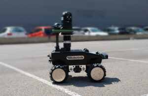 The RB-Watcher mobile robot patrols a parking lot.