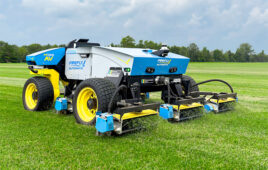 hero image of the new automatix m100AC mower on a grassy field.